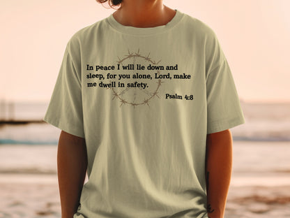 Light tan t-shirt with barbed wire peace sign and Psalm 4:8.