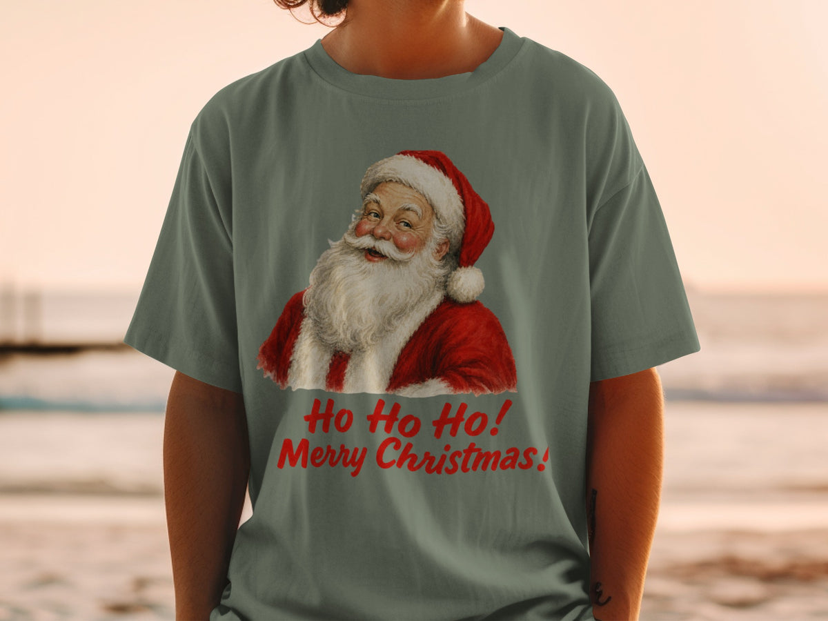 Santa Claus graphic with "Ho Ho Ho! Merry Christmas!" text on a green t-shirt.