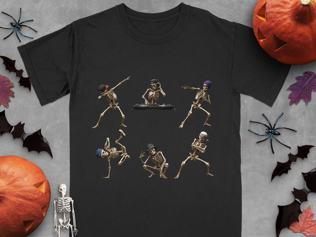 Six skeletons in various dance poses on a black t-shirt, surrounded by Halloween decorations.