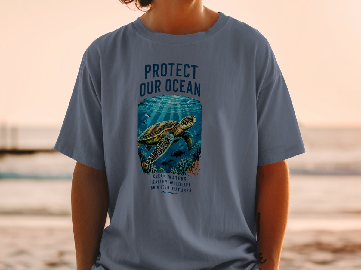 T-shirt with "PROTECT OUR OCEAN" text, a sea turtle, and ocean life.