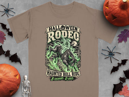 T-shirt graphic: "Halloween Rodeo Haunted Bull Ride" with a glowing bull and rider.