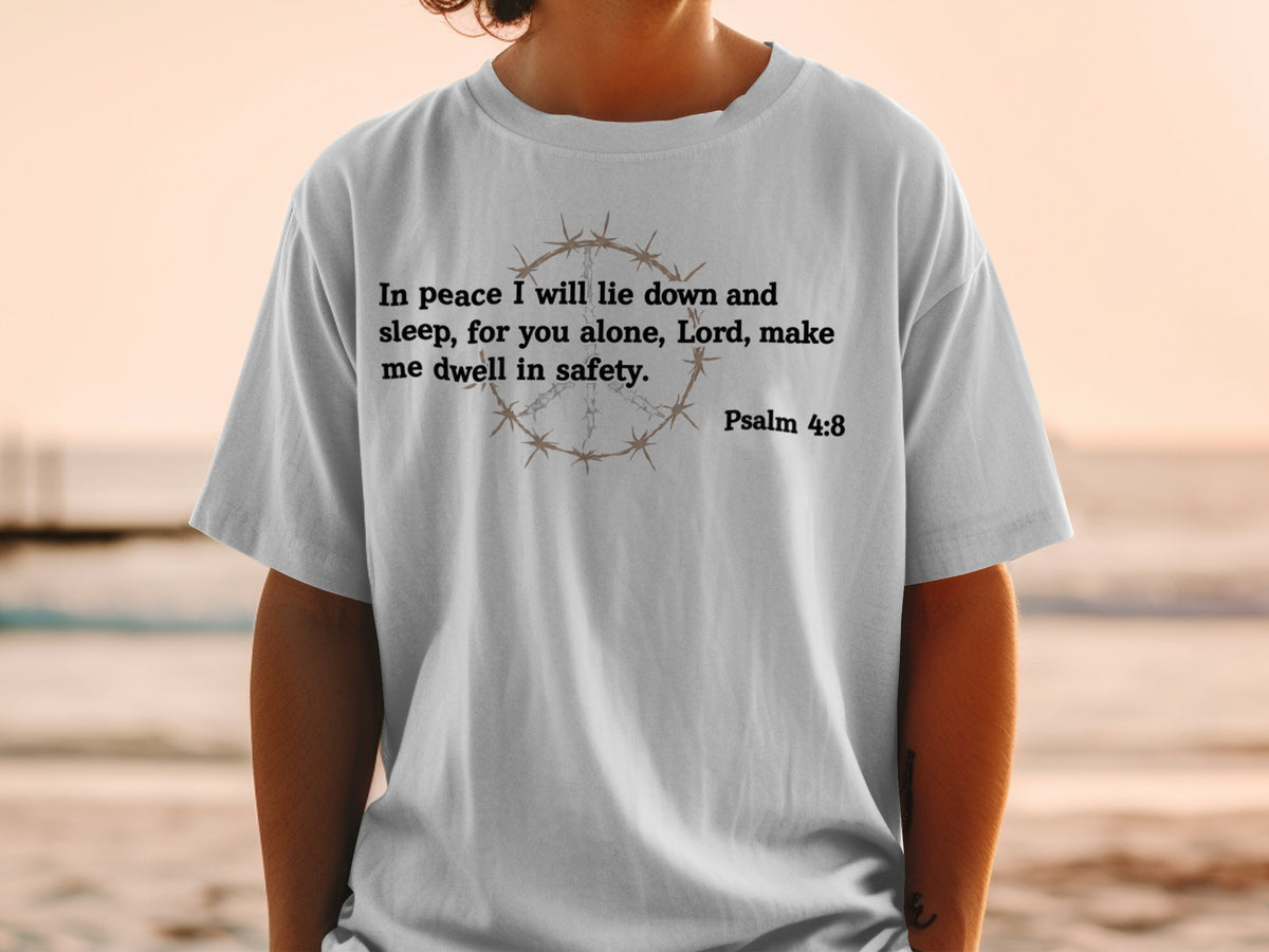 Gray t-shirt with "In peace I will lie down and sleep, for you alone, Lord, make me dwell in safety. Psalm 4:8" and barbed wire peace symbol.