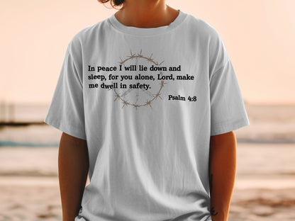 Gray t-shirt with "In peace I will lie down and sleep, for you alone, Lord, make me dwell in safety. Psalm 4:8" and barbed wire peace symbol.