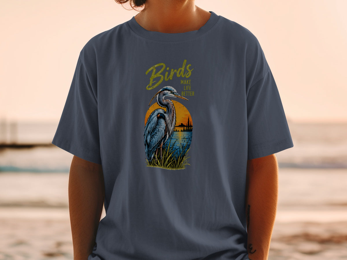 Heron in reeds with "Birds Make Life Better" text over sunset landscape.