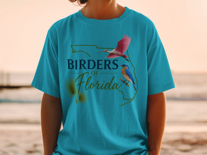 Turquoise t-shirt with "Birders of Florida" text and bird illustrations.