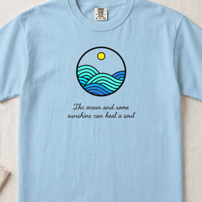 Light blue t-shirt with a round ocean graphic and text that reads The ocean and some sunshine can heal a soul.