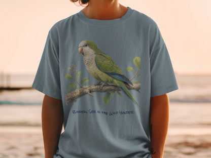 Green parrot on a branch with text "BIRDER: SEEN IN THE WILD YONDER".