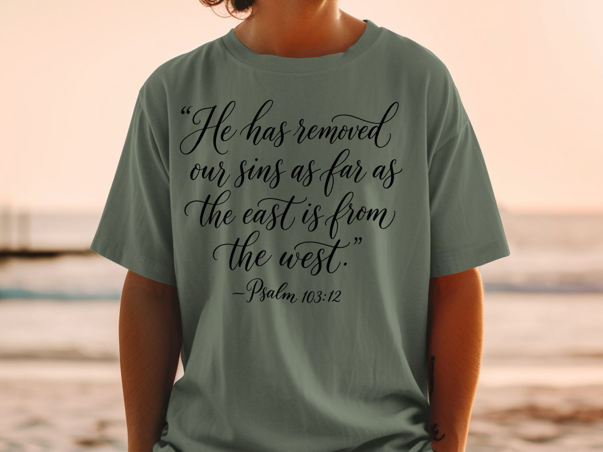 Olive green t-shirt with black text: "He has removed our sins as far as the east is from the west." -Psalm 103:12