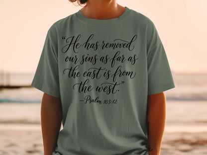 Olive green t-shirt with black text: "He has removed our sins as far as the east is from the west." -Psalm 103:12