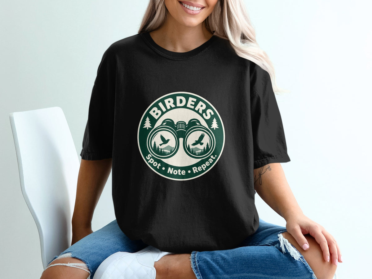 Black t-shirt with "Birders" logo featuring binoculars, birds, and mountains.