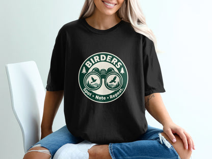 Black t-shirt with "Birders" logo featuring binoculars, birds, and mountains.