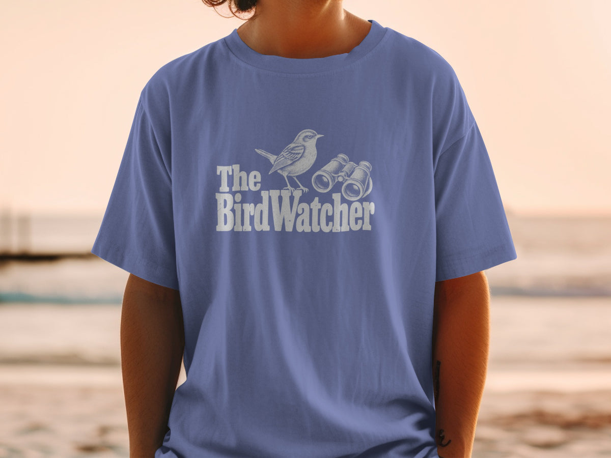 T-shirt with white graphic of bird and binoculars with text "The BirdWatcher".