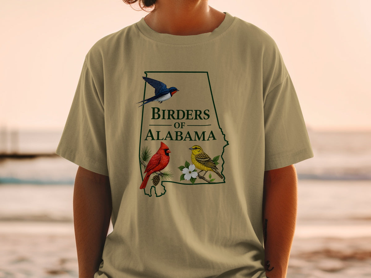 T-shirt graphic with Alabama outline, text, and two illustrated birds.