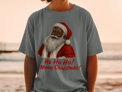 Santa Claus graphic with "Ho Ho Ho! Merry Christmas!" text on a gray t-shirt.