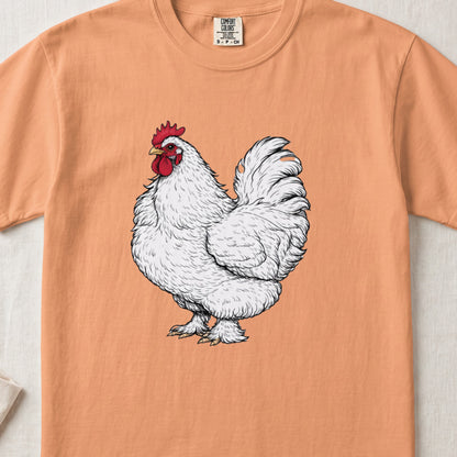 Peach-colored crewneck t-shirt featuring a detailed black and white illustration of a white rooster.