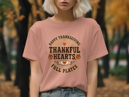 Thanksgiving t-shirt with "Thankful Hearts, Full Plates" text and festive graphics.