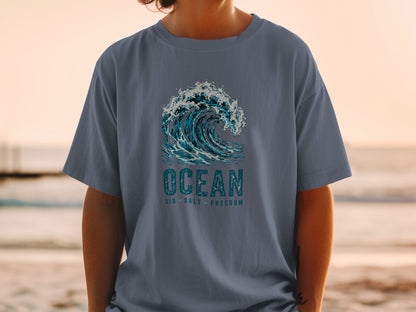 T-shirt with ocean wave graphic and text "OCEAN AIR SALT FREEDOM".