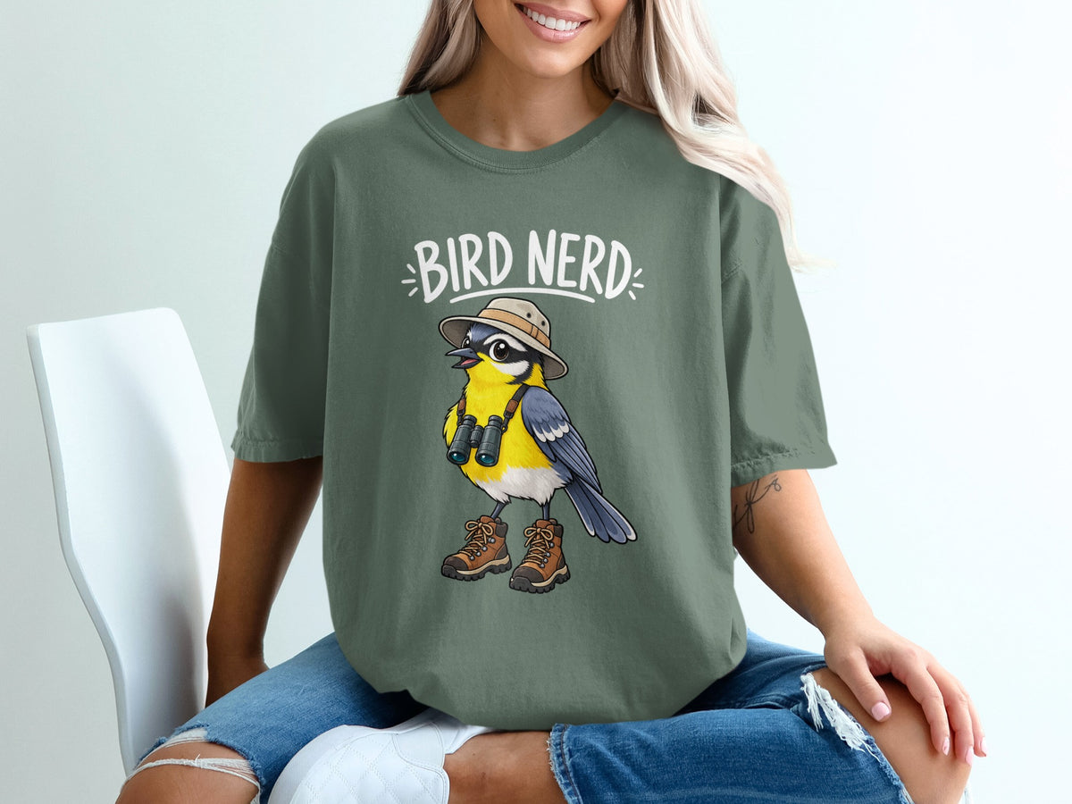 Green t-shirt with "Bird Nerd" text and cartoon bird wearing hat and binoculars.