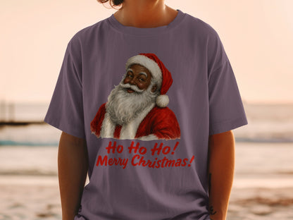 Purple t-shirt with a festive illustration of Santa Claus and red text that reads "Ho Ho Ho! Merry Christmas!"