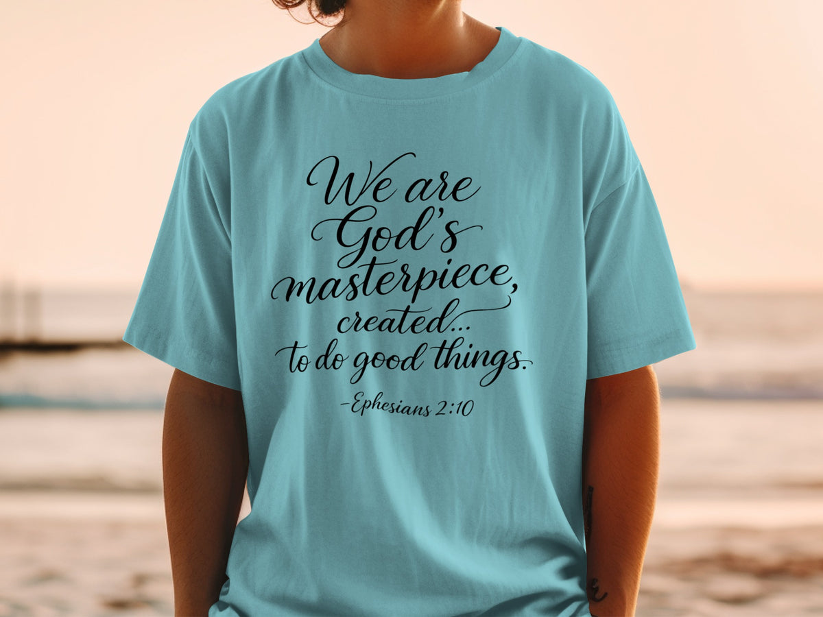 Teal t-shirt with "We are God's masterpiece, created... to do good things. -Ephesians 2:10" in black script.
