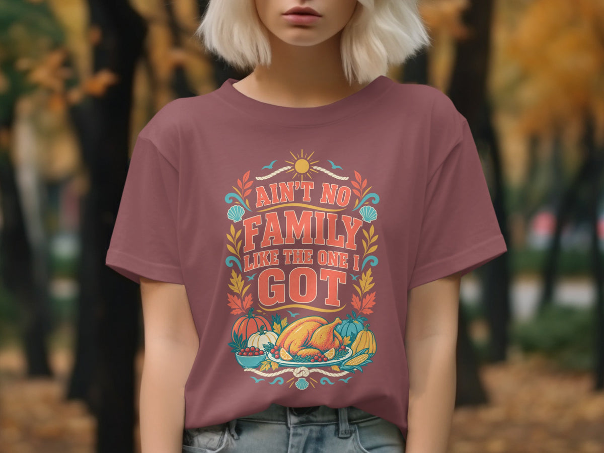 Maroon t-shirt with "Ain't No Family Like The One I Got" text and Thanksgiving imagery.