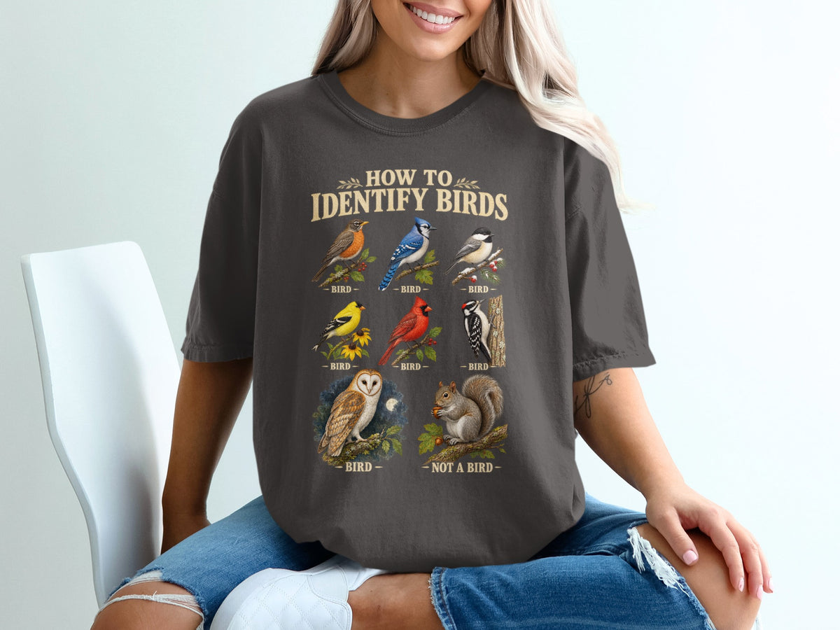 T-shirt graphic with "How to Identify Birds" text and illustrations of birds and a squirrel.
