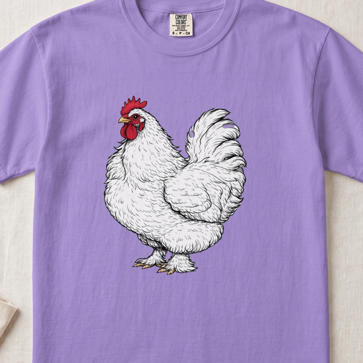 Light purple t-shirt featuring a detailed illustration of a white rooster on the front.