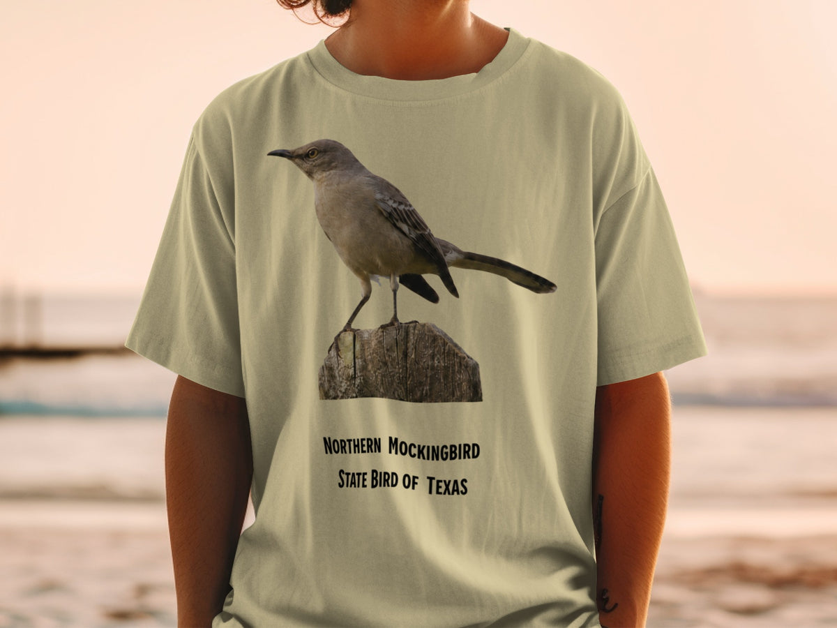 Northern Mockingbird, State Bird of Texas, on a light tan t-shirt.