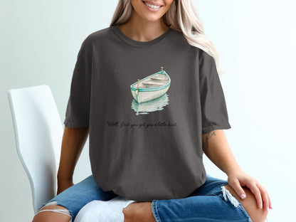 Dark gray t-shirt with watercolor boat graphic and text.
