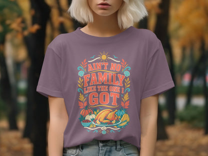 Purple t-shirt with "Ain't No Family Like The One I Got" graphic.