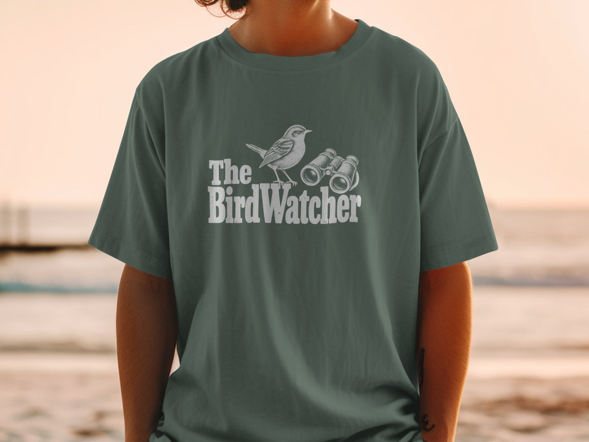 T-shirt with "The BirdWatcher" text, a bird illustration, and binoculars.