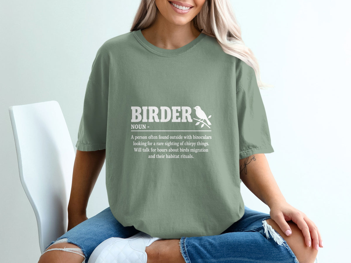 Green t-shirt with white text and a bird graphic describing "Birder."