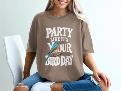 Brown t-shirt with "PARTY LIKE IT'S YOUR BIRDDAY" text and a blue bird illustration.