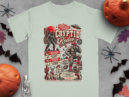 Cryptid Rodeo t-shirt graphic with Mothman, Bigfoot, Jackalope, and UFO.