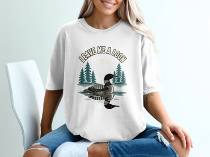 White t-shirt with a loon graphic and text "Leave Me A Loon".
