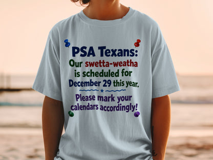 Light blue t-shirt with text "PSA Texans: Our swetta-weatha is scheduled for December 29 this year. Please mark your calendars accordingly!"