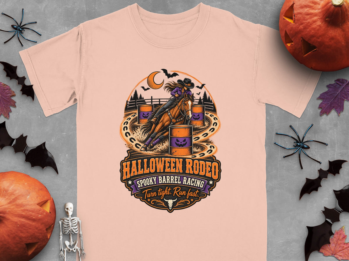 Peach t-shirt with Halloween Rodeo spooky barrel racing graphic.