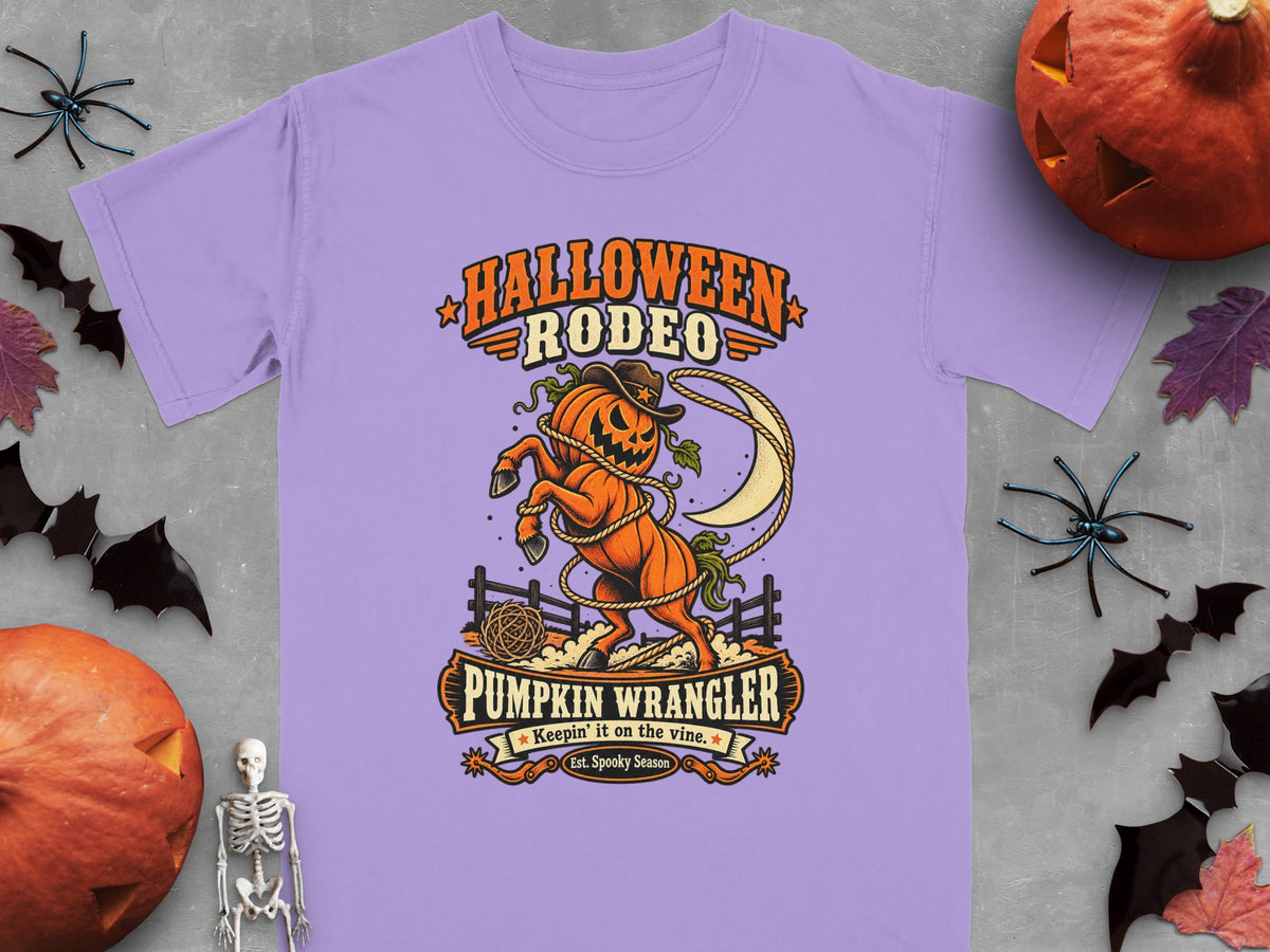 Lavender t-shirt with "Halloween Rodeo Pumpkin Wrangler" graphic of a jack-o-lantern horse.