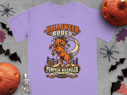 Lavender t-shirt with "Halloween Rodeo Pumpkin Wrangler" graphic of a jack-o-lantern horse.