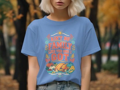 Blue t-shirt with text "Ain't No Family Like The One I Got" and Thanksgiving food illustration.
