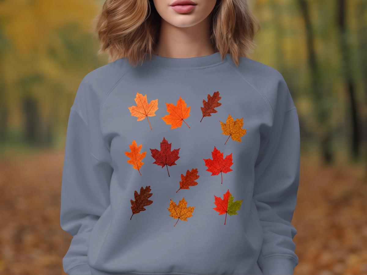 Grey sweatshirt featuring a scattered pattern of colorful autumn leaves.