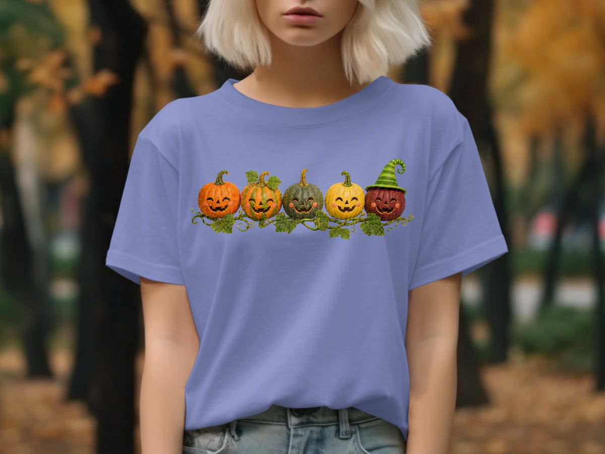 T-shirt with a row of five smiling pumpkins, one wearing a witch hat.