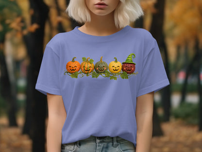 T-shirt with a row of five smiling pumpkins, one wearing a witch hat.