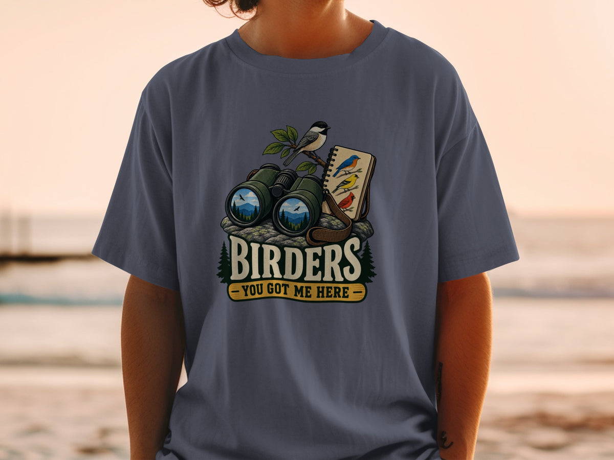 Graphic of binoculars and a bird-watching notebook with text "Birders You Got Me Here".