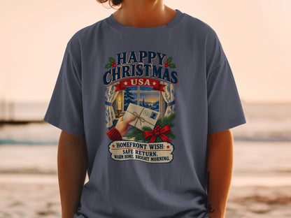 T-shirt graphic "Happy Christmas USA" with Christmas scene and "Homefront Wish" text.