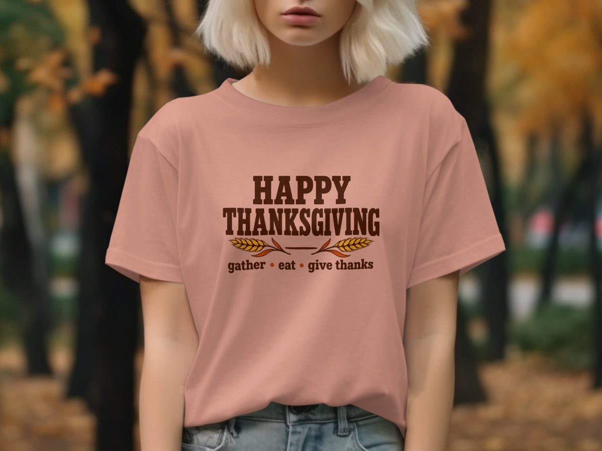 Peach t-shirt with "Happy Thanksgiving" text, wheat stalks, and "gather eat give thanks."