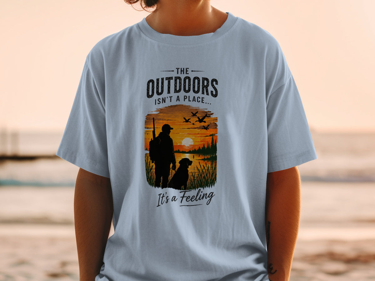 T-shirt graphic: "The Outdoors Isn't a Place... It's a Feeling" with a hunter, dog, and sunset.