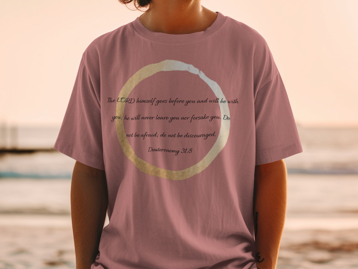 Pink t-shirt with Deuteronomy 31:8 verse printed inside a circular design.