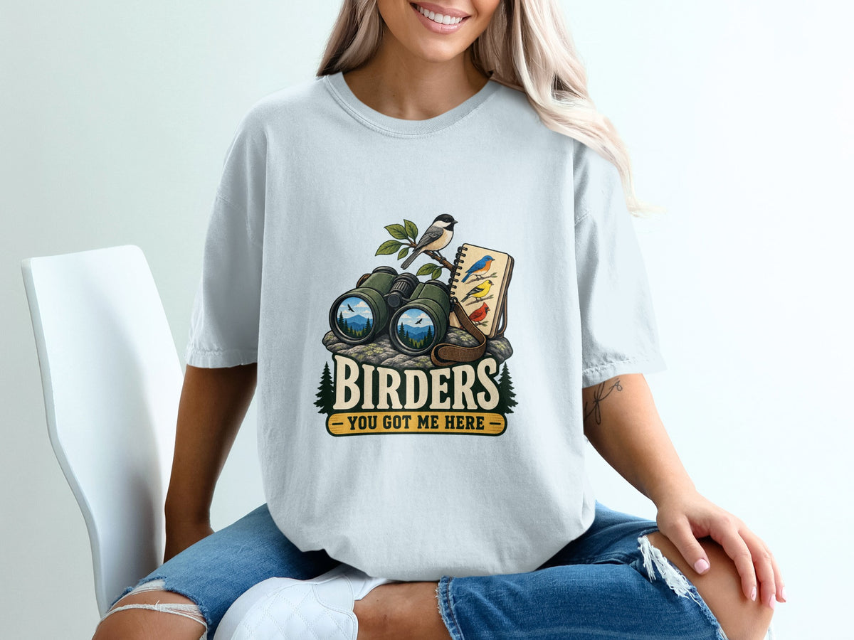 Birding graphic with binoculars, notebook, birds, and text "BIRDERS YOU GOT ME HERE".