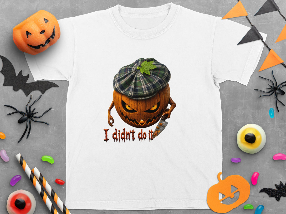 White t-shirt with a Halloween graphic of a pumpkin wearing a plaid hat, holding a knife, and text.
